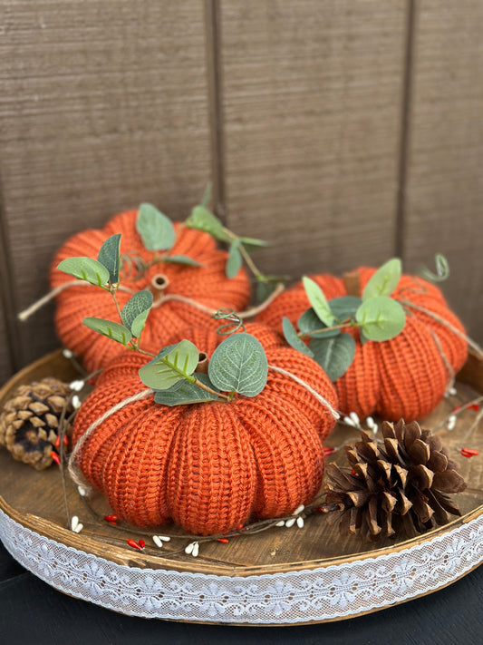 knit segmented pumpkin with greenery
