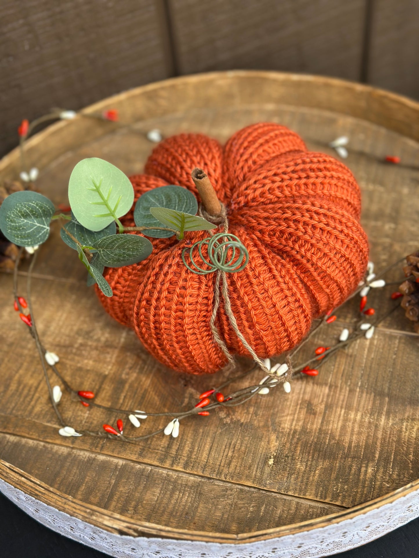 knit segmented pumpkin with greenery