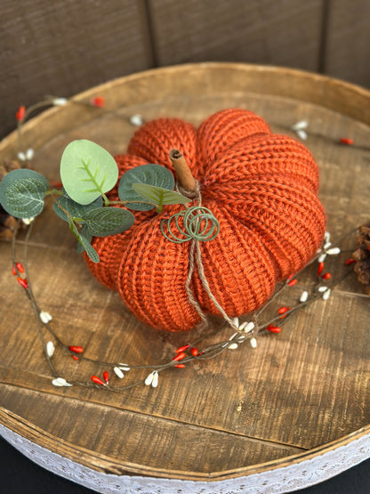 knit segmented pumpkin with greenery