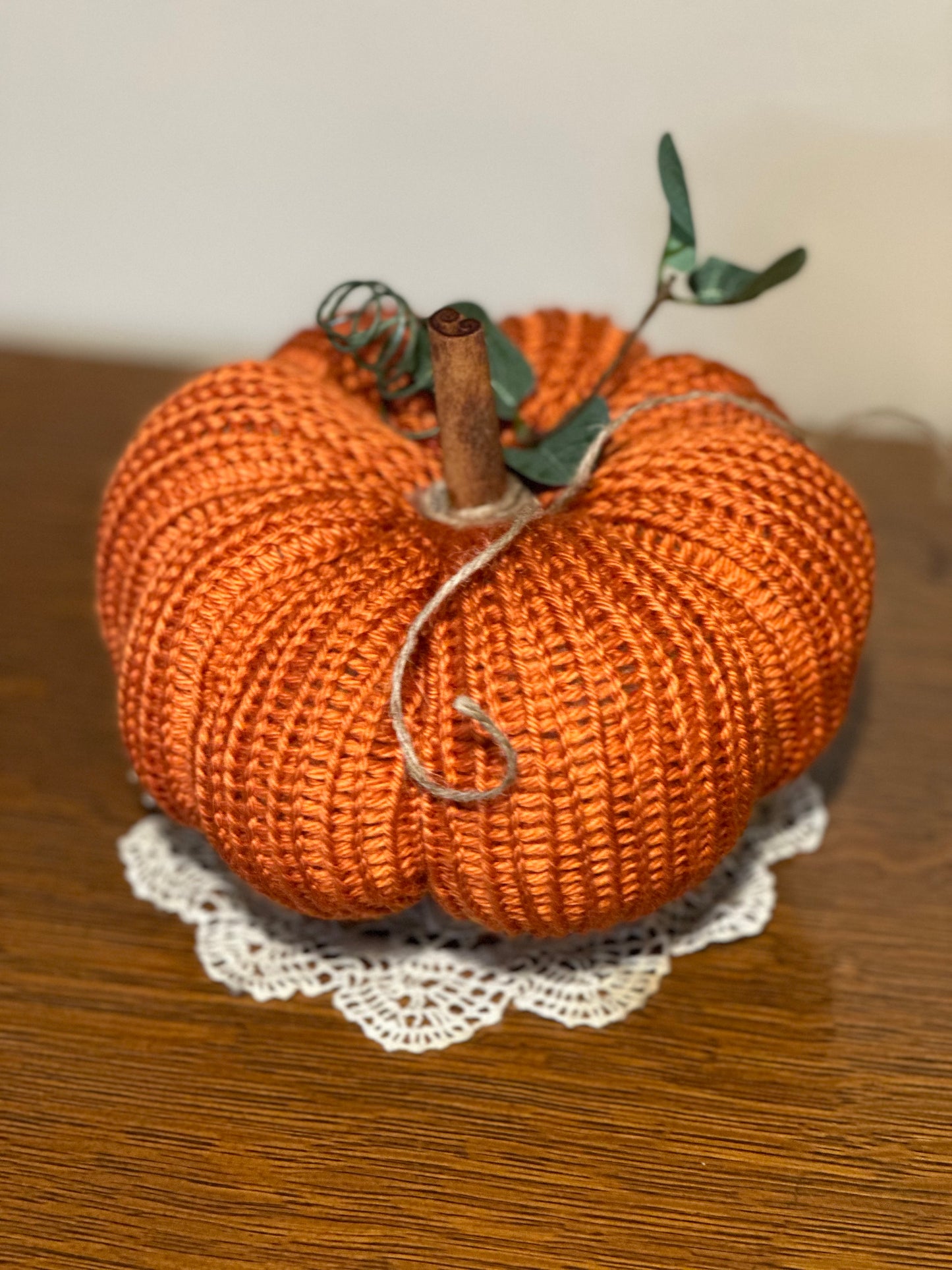 knit segmented pumpkin with greenery