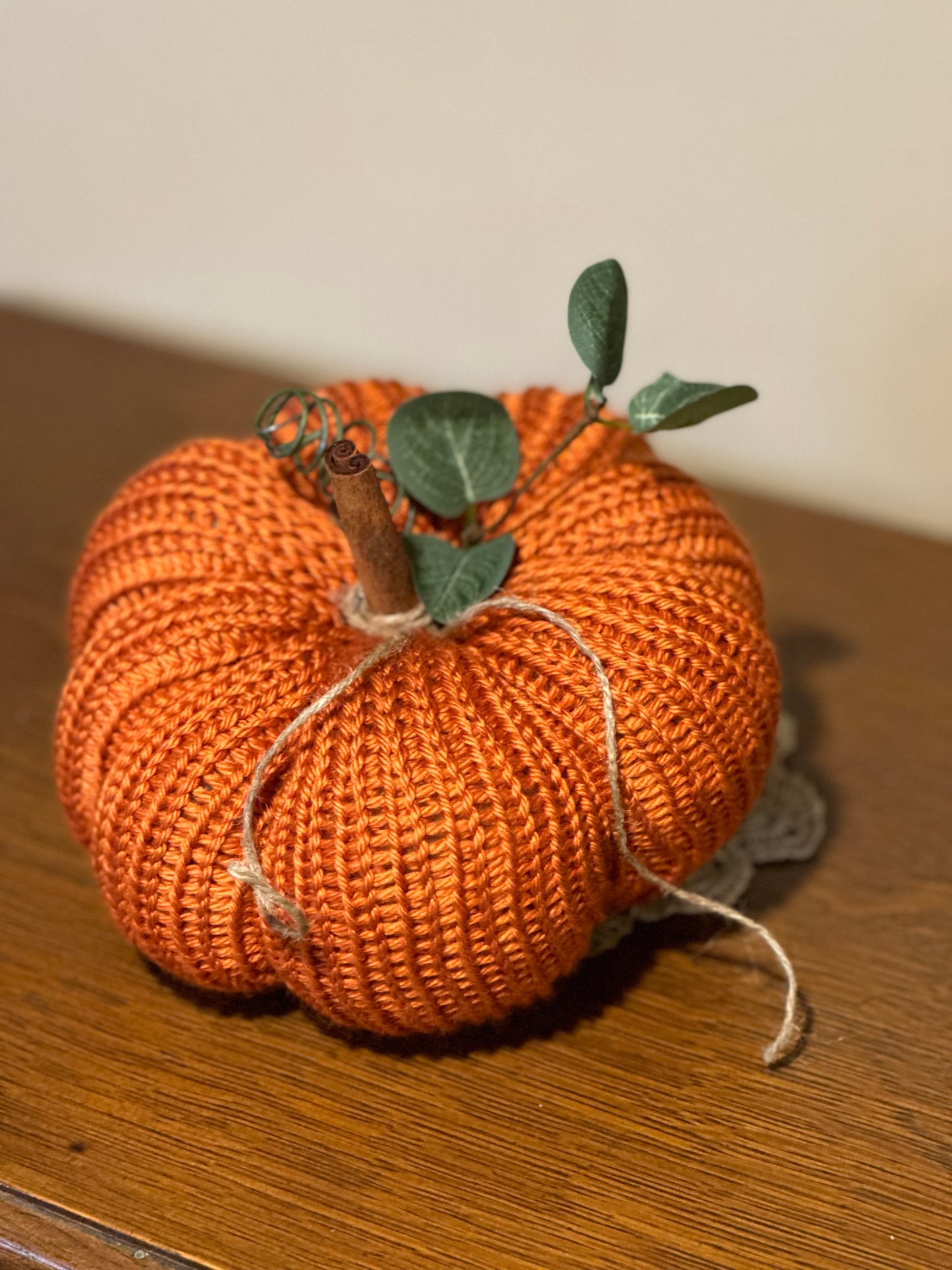 knit segmented pumpkin with greenery