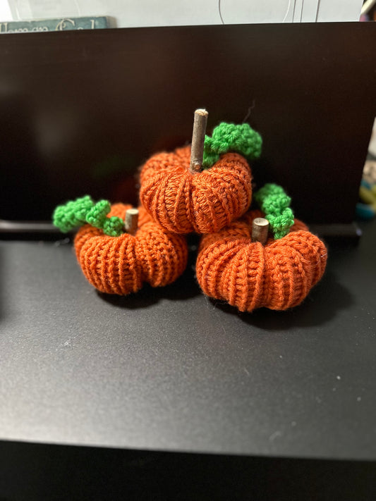 small orange segmented pumpkin