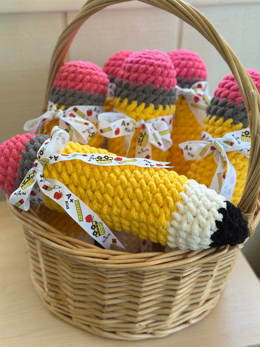 Basket filled with crochet plush pencils and added grosgrain ribbon with school buses

