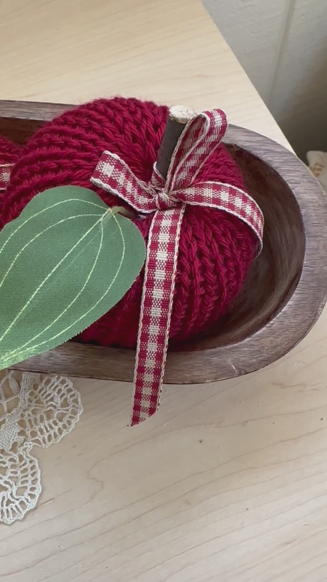 knit apple with green leaf and wood stem and green faux leaf
